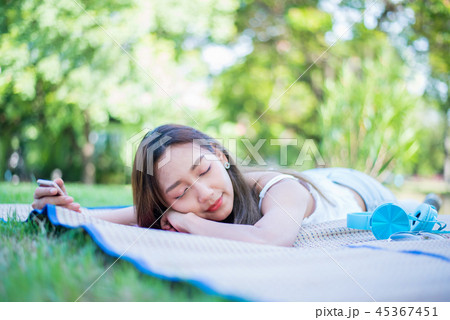 Young woman relaxing in the natural park. Young woman relaxing in the natural park. 45367451