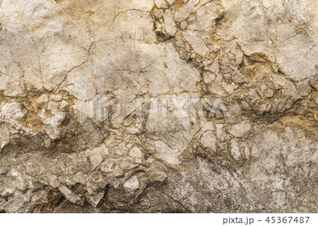 Fragment of an old gray wall. Background from an old piece of wall. Fragment of an old gray wall. Background from an old piece of wall. 45367487