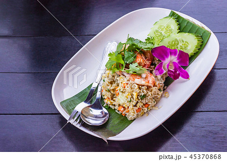 Fried rice with shrimp on the white ceramic dish. 45370868