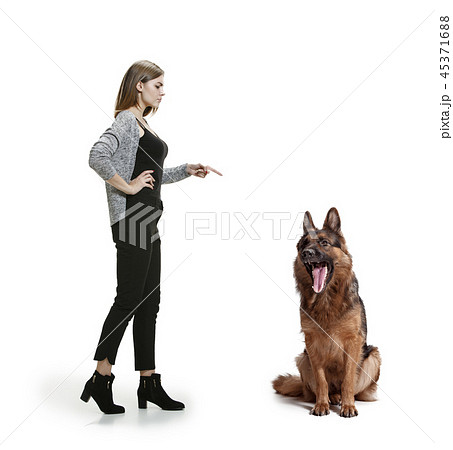Woman with her dog over white background Woman with her dog over white background 45371688