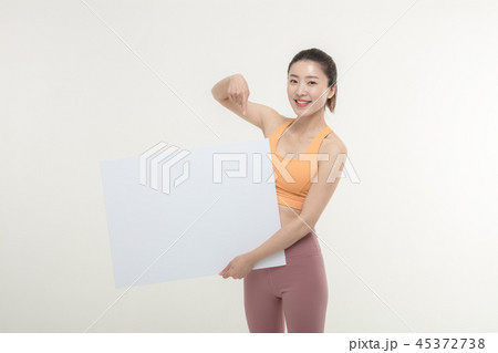a woman holding an ad board on a white background a woman holding an ad board on a white background 45372738