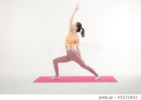 A Korean woman doing yoga exercise on mat 45372831