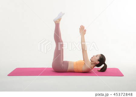 A Korean woman doing yoga exercise on mat 45372848