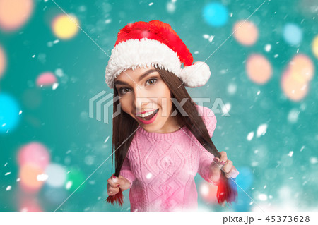 Girl holding her long hair 45373628