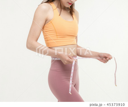 A Korean woman with a waist on a tape measure A Korean woman with a waist on a tape measure 45373910
