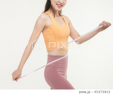 A Korean woman with a waist on a tape measure 45373913