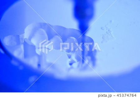 Dental milling machine carving out shape of human teeth 45374764