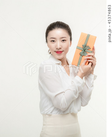 A woman who is delighted to receive a gift A woman who is delighted to receive a gift 45374863