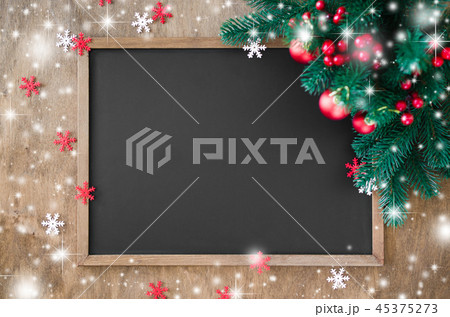 Empty blackboard with christmas decoration. Empty blackboard with christmas decoration. 45375273