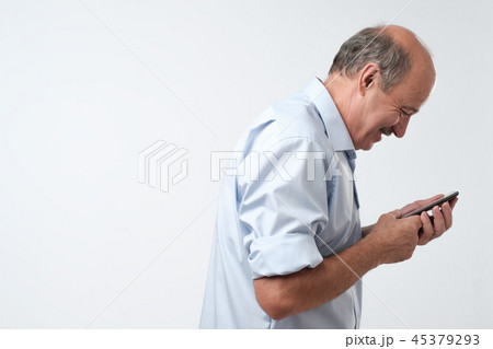 man reading sms on his phone man reading sms on his phone 45379293