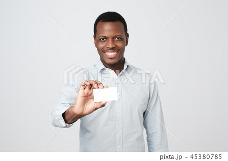 Young african man holding bank visiting card Young african man holding bank visiting card 45380785