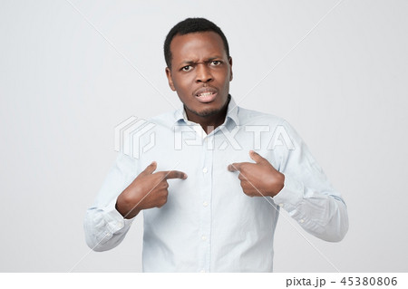 Young african man pointing at himself 45380806