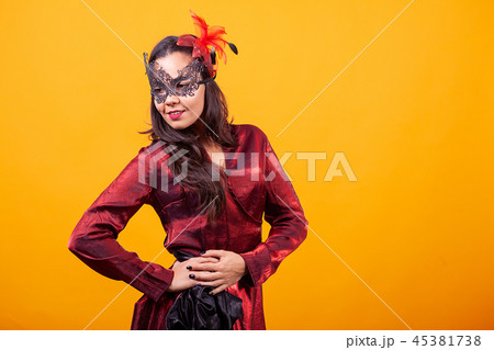 Beautiful young woman wearing argentinian red dress. 45381738