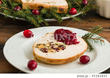 Stuffed turkey breast roll with cranberry sauce Stuffed turkey breast roll with cranberry sauce 45381835