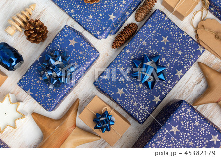Presents in blue wrapping paper on table Presents in blue wrapping paper on table 45382179