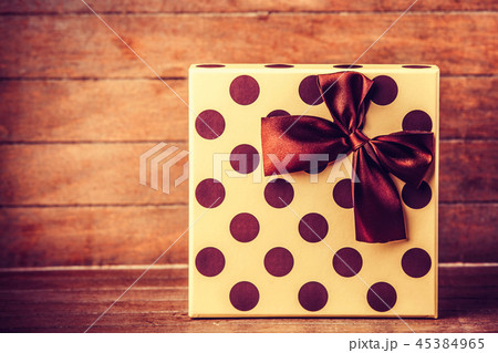 Christmas box with polka dots with a bow 45384965