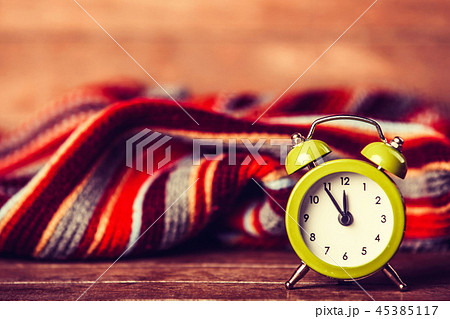 Alarm clock and scarf. 45385117