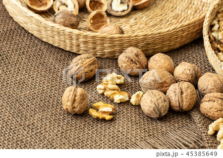 Walnuts on rustic natural burlap Walnuts on rustic natural burlap 45385649
