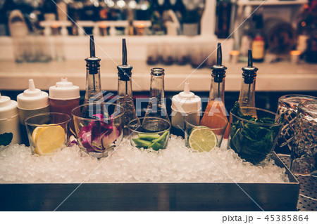Ingredients and syrups cocktails at bar counter 45385864