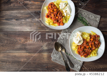 Pappardelle pasta with ragout and burrata cheese 45386212