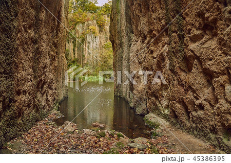 Lake between cliffs 45386395