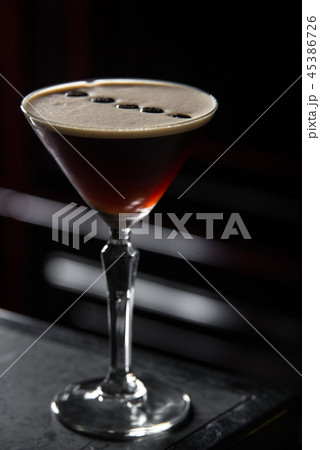 Espresso Martini cocktail on a bar desk. black background. Espresso Martini cocktail on a bar desk. black background. 45386726