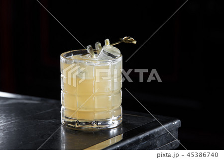 Penicillin cocktail on a bar desk. black background. 45386740