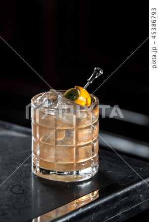 Mexican old fashion on a bar desk. black background Mexican old fashion on a bar desk. black background 45386793