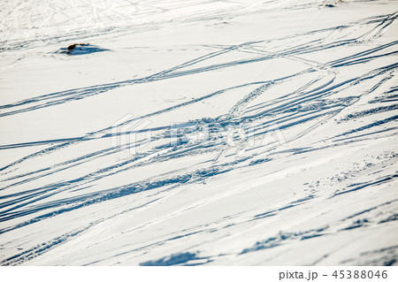 Image of snow surface with ski in winter 45388046