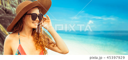 Happy young woman at beach in summer vacation. 45397929