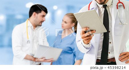 Doctor working in hospital with other doctors. Doctor working in hospital with other doctors. 45398214