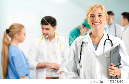 Doctor working in hospital with other doctors. 45398404