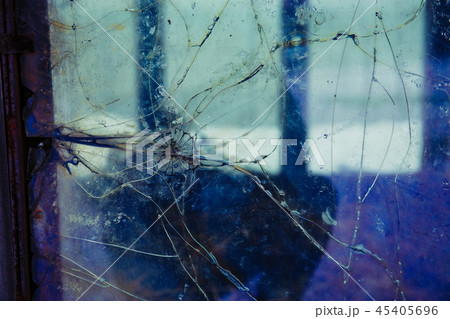 Cracked and broken window, Industrial background Cracked and broken window, Industrial background 45405696
