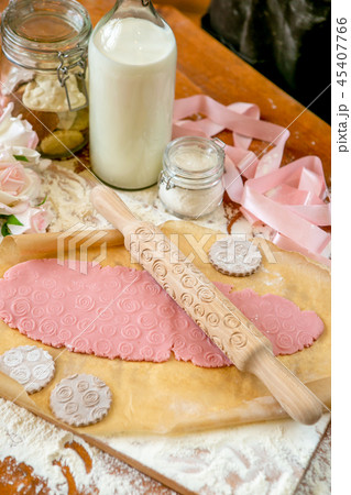 Rolling pin with a pattern on a wooden table 45407766