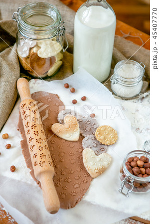 Rolling pin with a dog paw pattern on a table  45407770