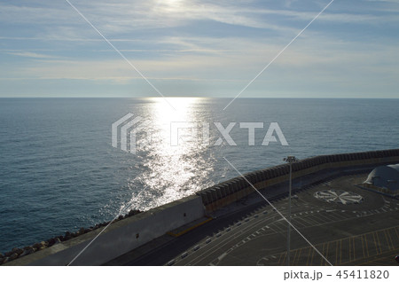 Beautiful sunset and silver path on the sea, blue clouds in the sky, background 45411820