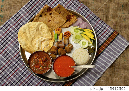 Maharashtrian lunch thali with Amras poli, India 45412502