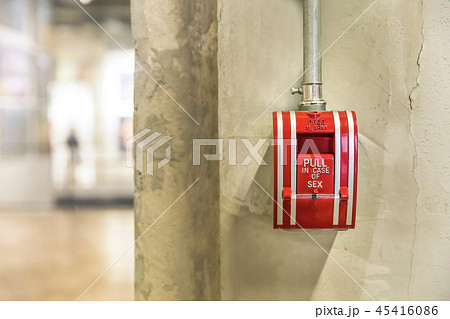 Selective focus on red gear alarm on the wall 45416086