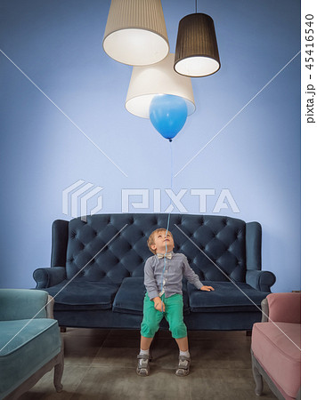 Children celebration background. Happy childhood concept. Cute boy with balloon having fun at home. Children celebration background. Happy childhood concept. Cute boy with balloon having fun at home. 45416540