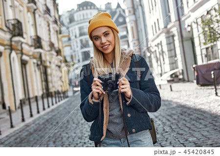 Young tourist blogger is walking with camera in old city 45420845