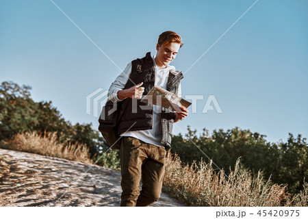 Young tourist blogger is exploring the map 45420975