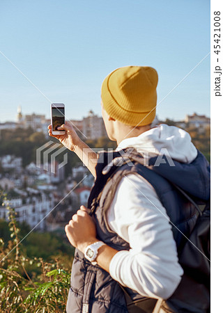 Young tourist blogger man is making selfie, rear view Young tourist blogger man is making selfie, rear view 45421008