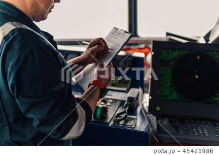 Marine navigational officer or chief mate on navigation watch Marine navigational officer or chief mate on navigation watch 45421986