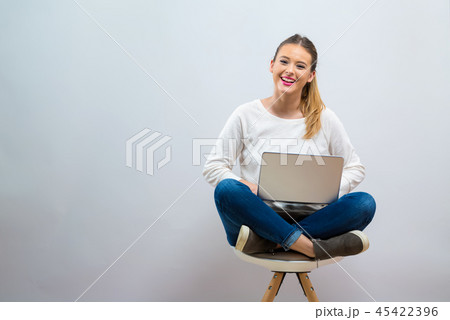 Young woman with a laptop computer 45422396