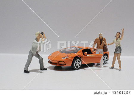 small figure with the toy sport car 45431237
