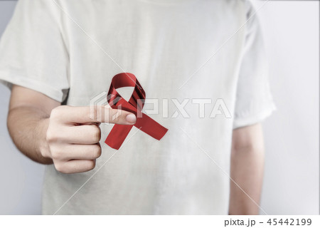 Man holding red ribbon Hiv Aids 45442199