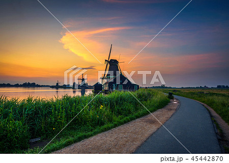 Sunset above historic windmills of Zaanse Schans in the Netherlands Sunset above historic windmills of Zaanse Schans in the Netherlands 45442870