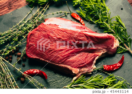 raw beef meat with spices on slate stone kitchen raw beef meat with spices on slate stone kitchen 45443114