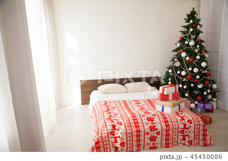 Christmas new year tree Interior bedroom and bed with gifts Christmas new year tree Interior bedroom and bed with gifts 45450086