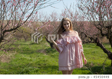 beautiful blonde woman in a flowered rose garden beautiful blonde woman in a flowered rose garden 45450449